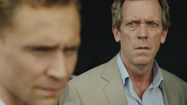 Hugh Laurie's Richard Roper looks over at Tom Hiddleston's Jonathan Pine in The Night Manager