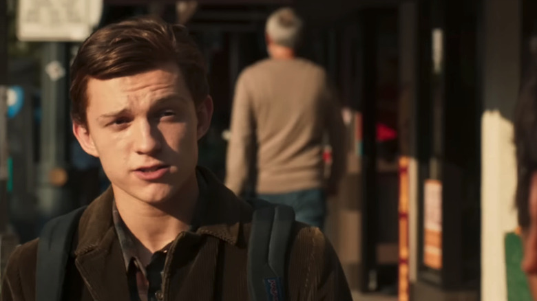 Tom Holland's Peter Parker looks across frame in closeup in Spider-Man: Homecoming