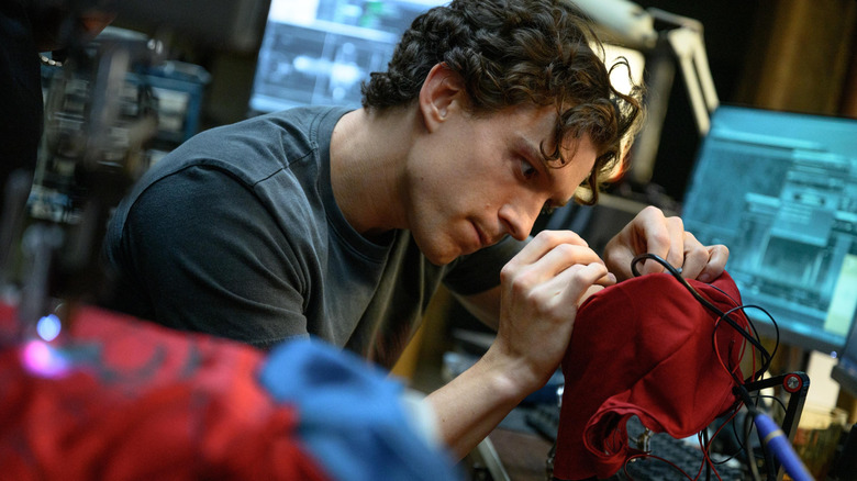 Peter sewing his suit in Spider-Man: Brand New Day