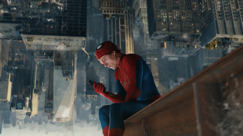 Peter checking his phone in Spider-Man: Brand New Day