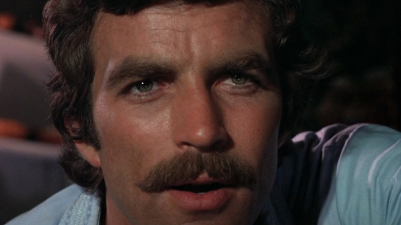 Tom Selleck's James Robertson is seen in closeup in Daughters of Satan
