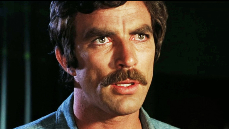 Tom Selleck's James Robertson looks worried in closeup in Daughters of Satan
