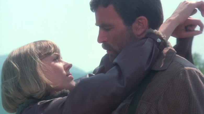 Tom Selleck's Patrick O'Malley stands face to face with Bess Armstrong's Eve Tozer in High Road to China
