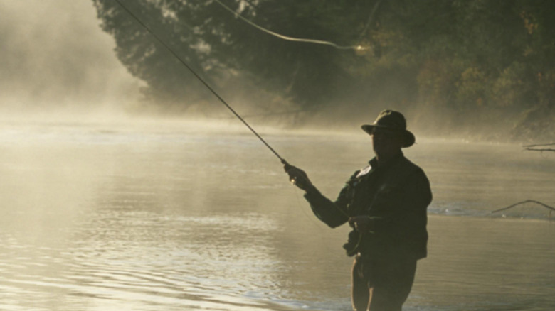 Tom Skerritt casts a fly-fishing line as Reverend Maclean in A River Runs Through It