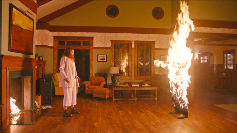 Toni Collette burning figure