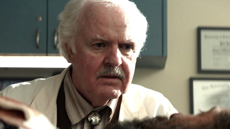 James Handy in Logan, dressed as a doctor