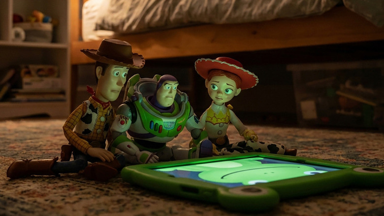 Woody, Buzz, and Jessie examining the Lilypad in Toy Story 5