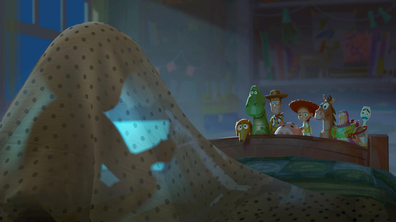 Concept art of Tom Hanks as Woody, Tim Allen as Buzz, Joan Cusack as Jessie, Blake Clark as Slinky, and Tony Hale as Forky worriedly watching a child playing on a tablet in Toy Story 5