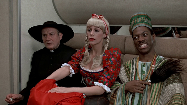 Coleman, Ophelia and Valentine sitting on train in disguises