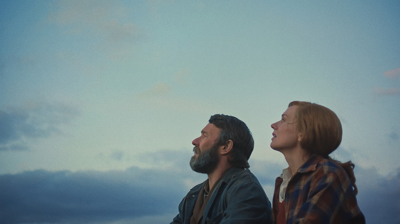 Robert and Claire look up at the sky in Train Dreams