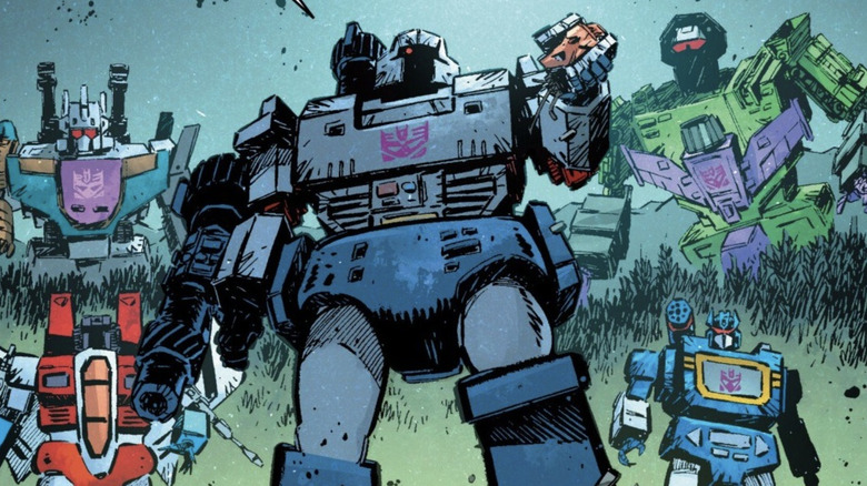 Transformers #21, Decepticon groupshot - Starscream, Bruticus, Megatron (holding Slingshot's head), Soundwave, and Devastator