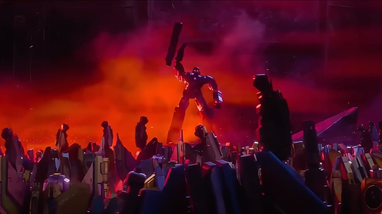 Megatron commanding a crowd of Decepticons to rise up in Transformers One