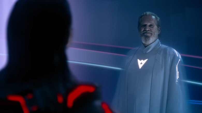 Ghostly Kevin Flynn looking at Ares in the original Grid in Tron: Ares