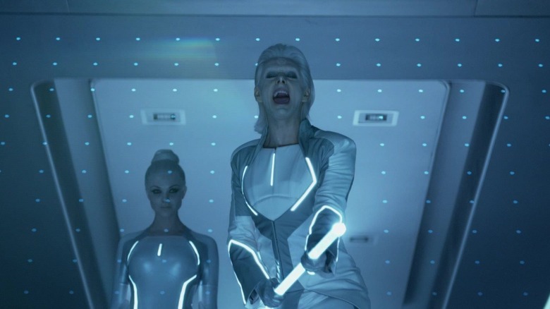Michael Sheen as Zuse/Castor wielding his cane in Tron: Legacy