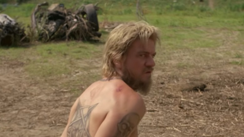 Charles Halford's Reggie Ledoux stands handcuffed in True Detective