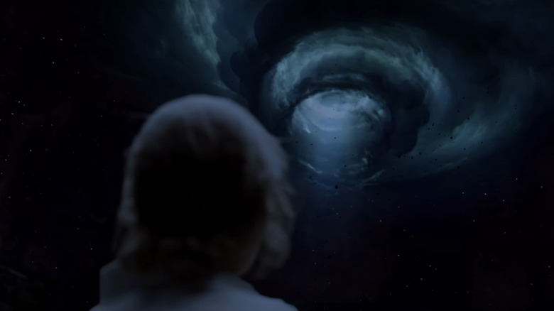 Matthew McConaughey's Rustin Cohle looks up at a hallucination of a spiral in True Detective