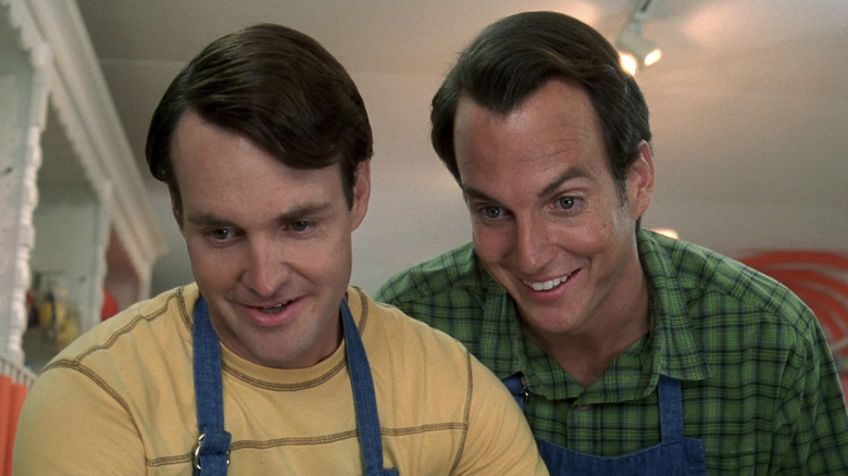 Will Forte's Dean Solomon and Will Arnett's John Solomon stand side by side looking down at something off screen in The Brothers Solomon