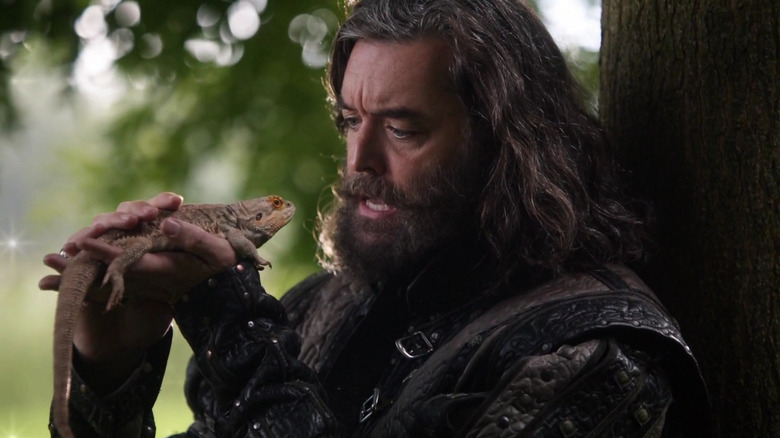 Richard (Timothy Omundson) holds his pet lizard Tad Cooper in ABC's Galavant series