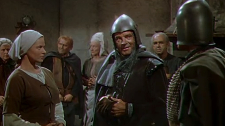 Ingrid Bergman's Joan of Arc is seen standing alongside Leif Erickson's Jean de Dunois in Joan of Arc