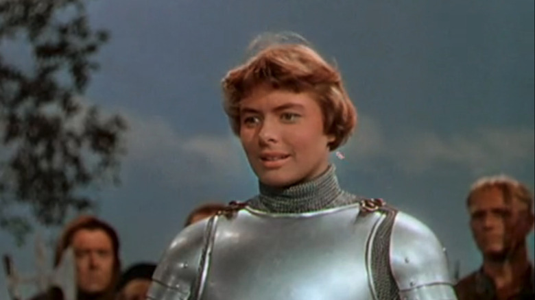 Ingrid Bergman's Joan of Arc smiles wearing a suit of armor in Joan of Arc