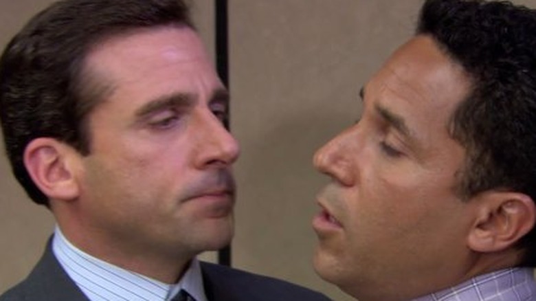 Michael Scott kissing Oscar Martinez in The Office