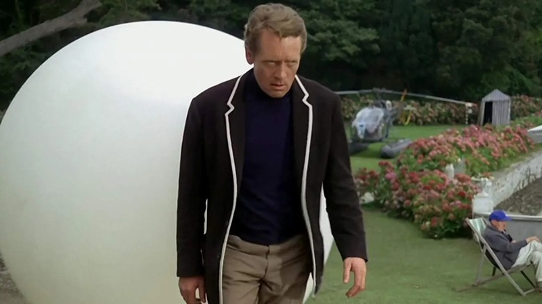 Number Six (Patrick McGoohan) tours the Village with Rover close behind in The Prisoner
