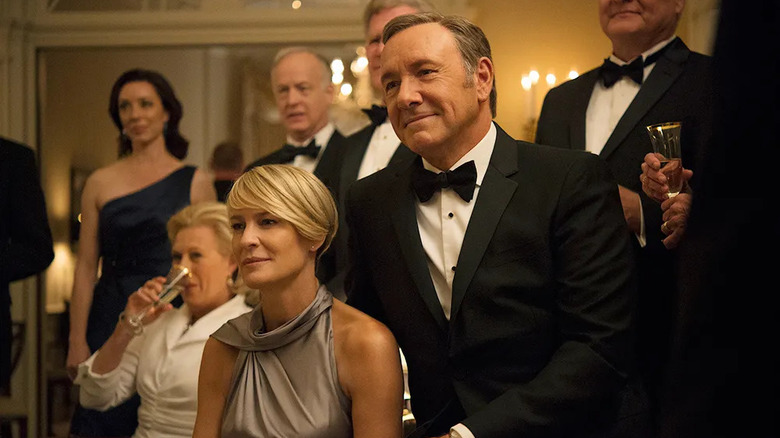 Claire and Frank smiling at a party on House of Cards