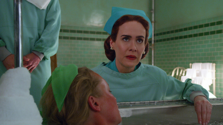 Nurse Ratched treating a patient and looking angry on Ratched