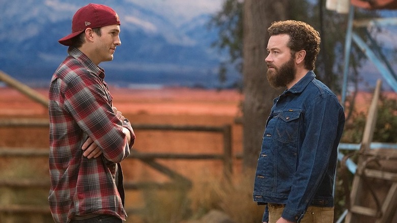 Colt and Rooster looking at each other on the ranch on The Ranch