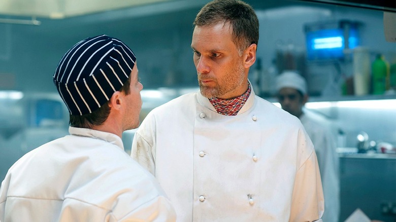 Darren Boyd and Stephen Wright as Bib and Skoose confronting each other in the kitchen in Whites