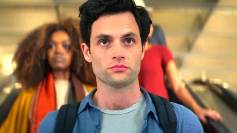 Joe Goldberg (Penn Badgley) descends an escalator to hell in You