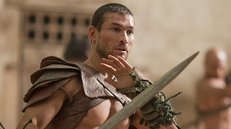 Andy Whitfield as Spartacus with a sword in Spartacus: Blood and Sand