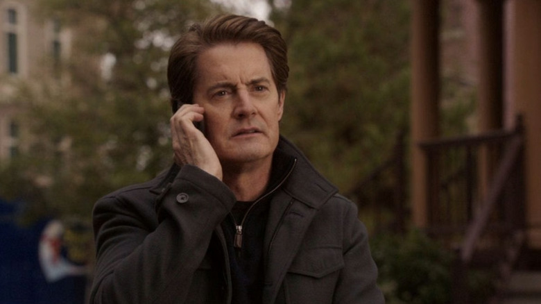 Orson listening to his phone on Desperate Housewives
