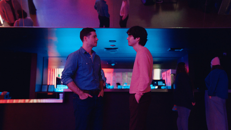 Roman and Dennis at a party in Twinless