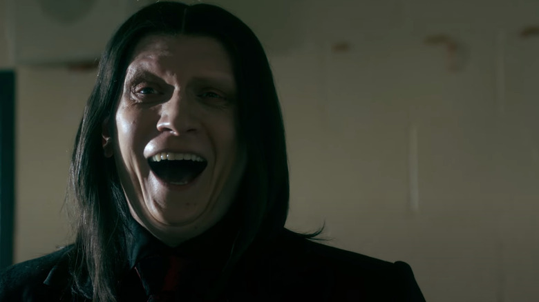 Anthony Carrigan as Calypso laughing diabolically in Twisted Metal