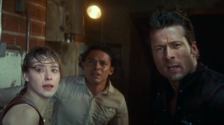 Daisy Edgar-Jones, Glen Powell and Anthony Ramos looked scared during a storm in Twisters