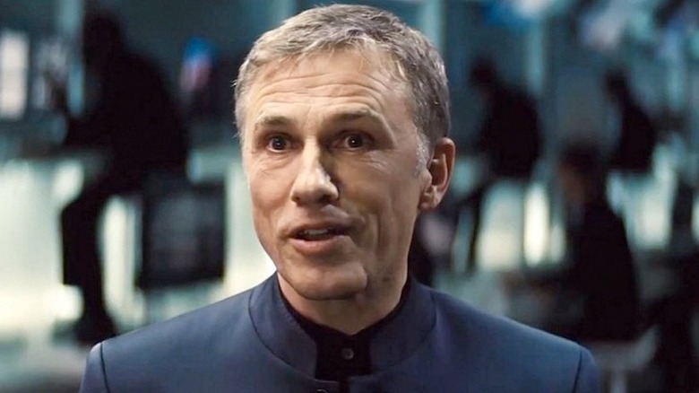 Christoph Waltz stands in a command center in Specter