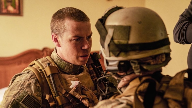 Erik in full fatigues looking at another soldier with concern in Warfare