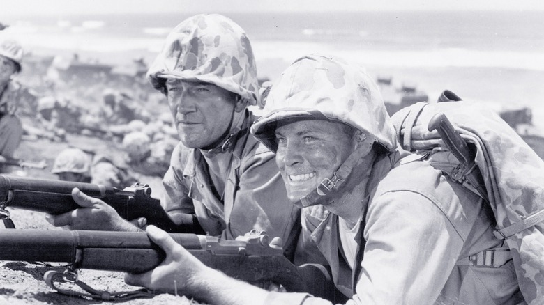 Sgt. Stryker and a fellow solider with a gun during a battle in Sands of Iwo Jima