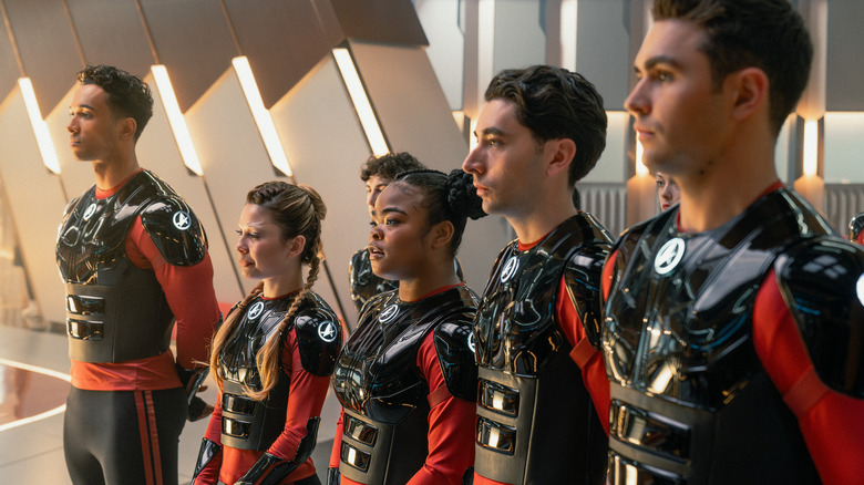 Caleb, Genesis, Sam, Ocam, and Darem all standing in a line in combat uniforms in Star Trek: Starfleet Academy