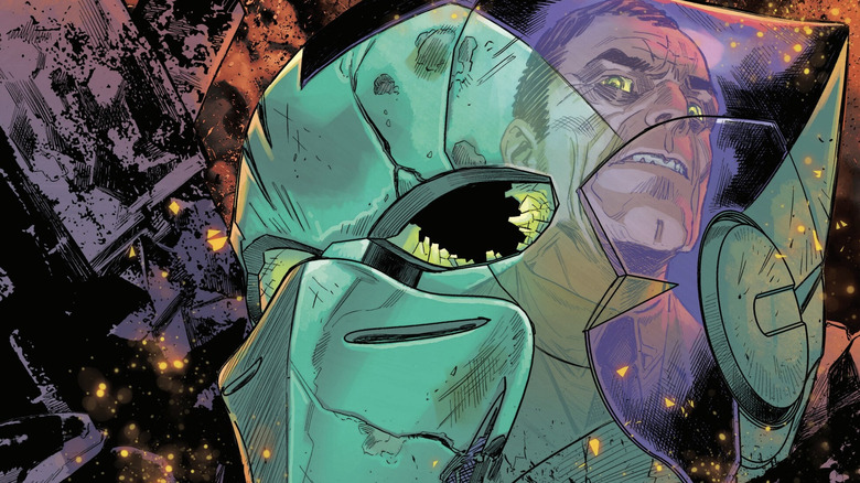The shattered Green Goblin mask with Norman Osborn's reflection on the Ultimate Spider-Man #17 cover