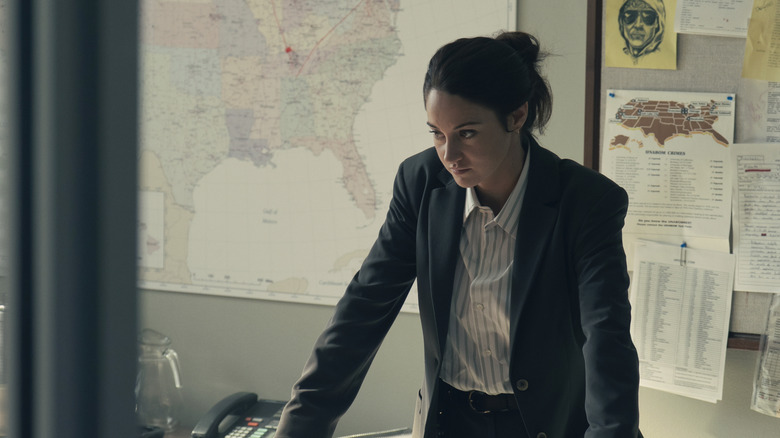 FBI agent Joanne Miller stands in front of maps in Unabomber