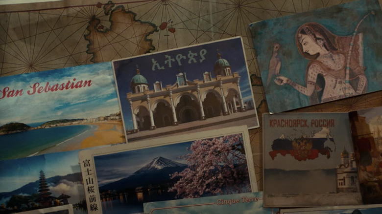 Postcards and photos laid out on a table