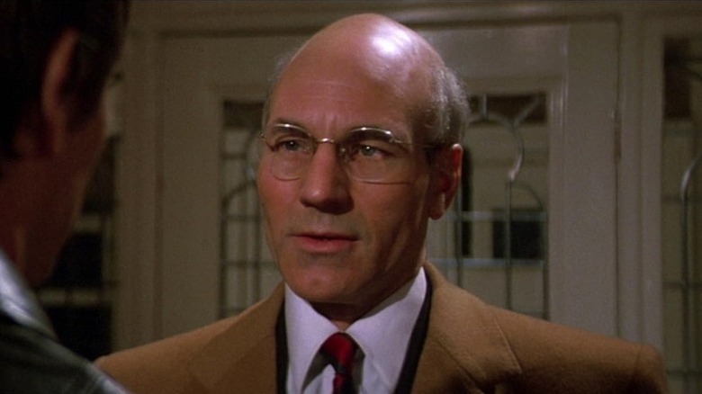 Armstrong (Patrick Stewart) speaks in a hospital office in Lifeforce