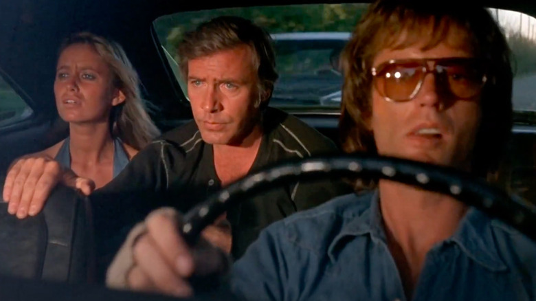 Larry, Deke, and Mary driving in a car