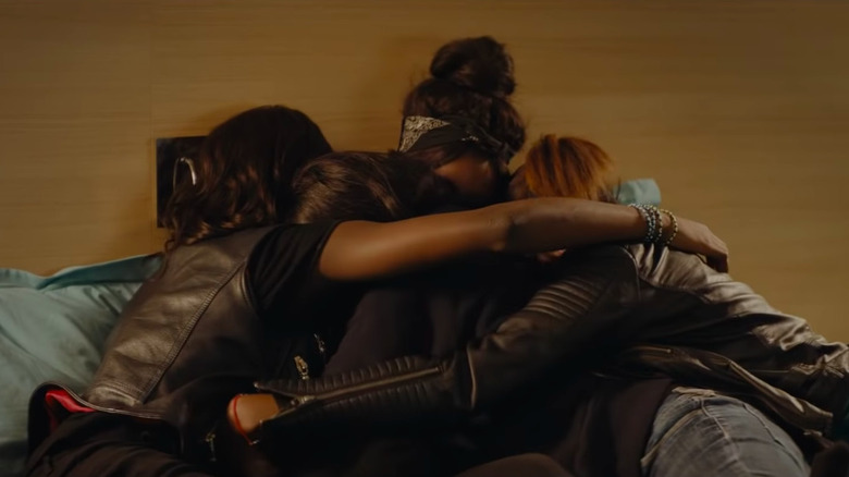 Karidja Touré as Marieme in a group hug