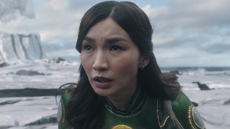 Gemma Chan as Sersi looking up in dismay in Eternals