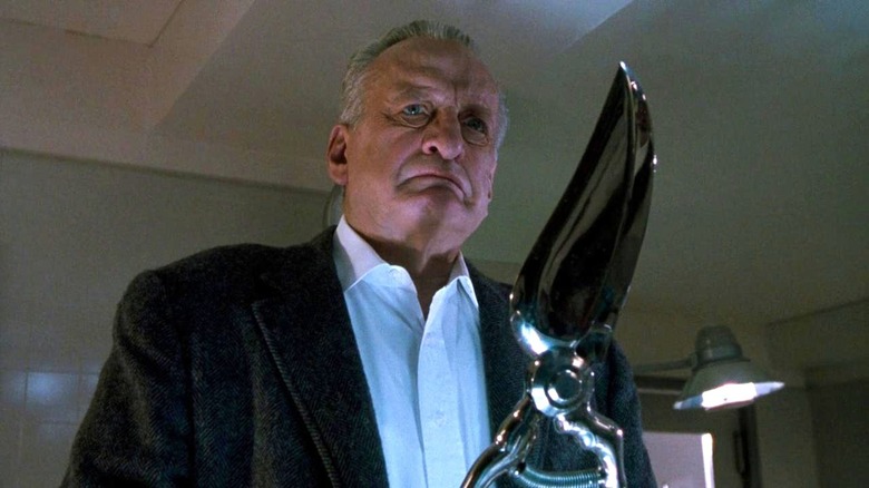 George C. Scott holding massive shears
