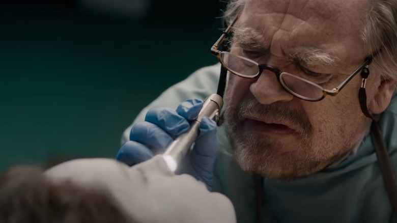 Brian Cox examining a corpse