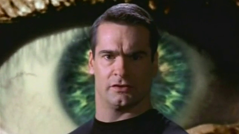 Henry Rollins in front of eyeball backdrop Night Visions